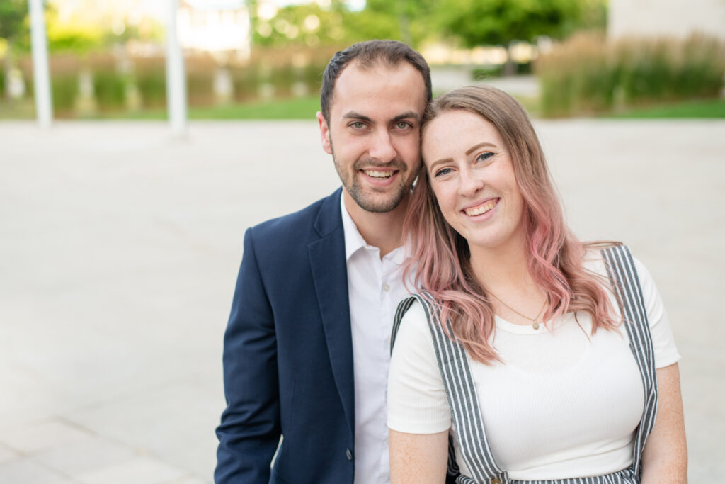 A couple snuggles close together and smiles during a couple's session with Salt Lake photographer Jodi Cornwall Photography.